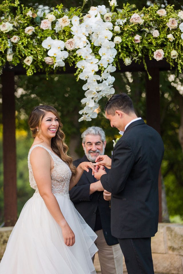 Styled wedding shoot at Olympia Hills San Antonio bride and groom at the ceremony ring exchange him