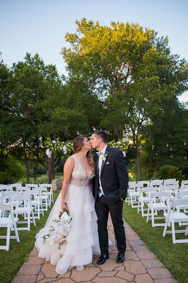 Styled wedding shoot at Olympia Hills San Antonio bride and groom on the aisle kissing