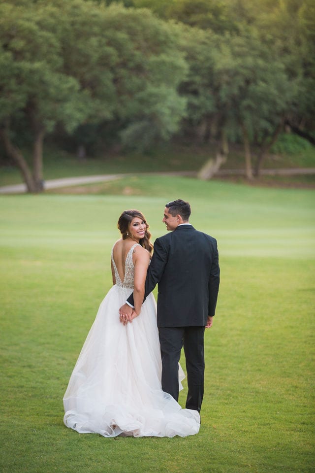 Styled wedding shoot at Olympia Hills San Antonio bride and groom on the green