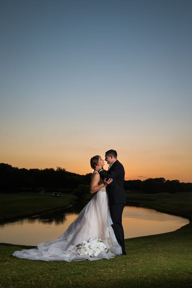 Styled wedding shoot at Olympia Hills San Antonio bride and groom by the pond at sunset