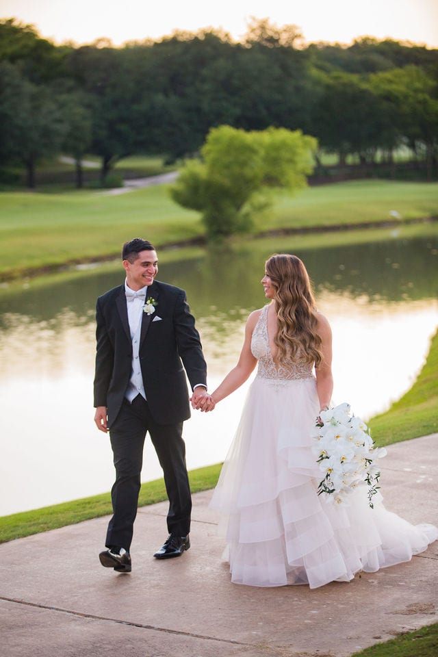 Styled wedding shoot at Olympia Hills San Antonio bride and groom walking by the pond