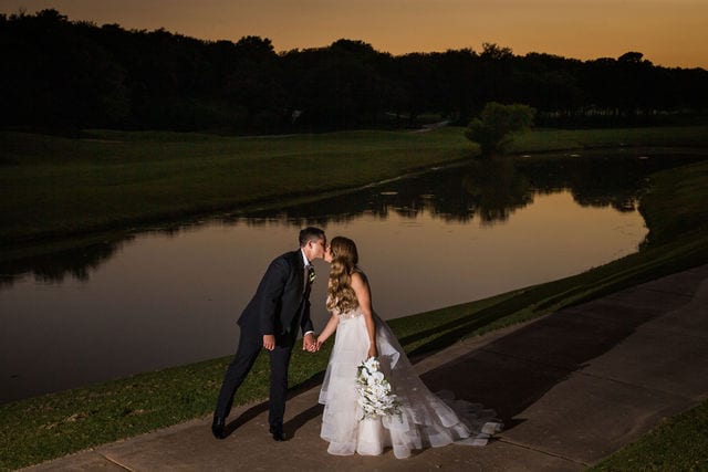 Styled wedding shoot at Olympia Hills San Antonio bride and groom by the pond dark sunset