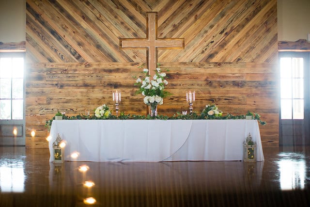 Rafter E Venue styled shoot head table with flowers