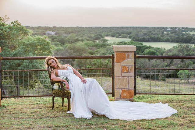 Rafter E Venue styled shoot bride seated at sunset