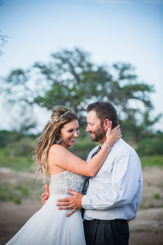 Rafter E Venue styled shoot bride and groom snuggling