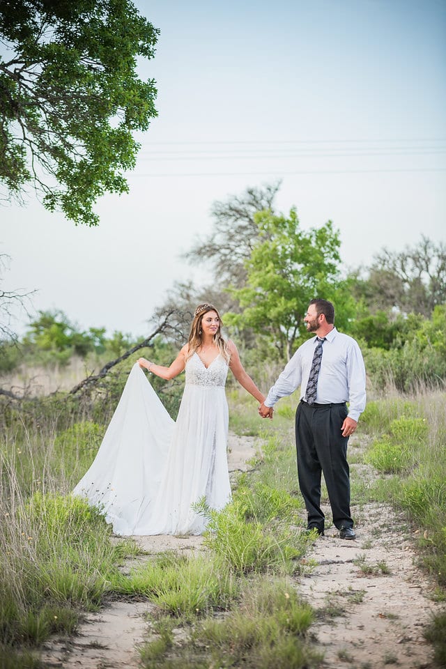 Rafter E Venue styled shoot bride and groom walking