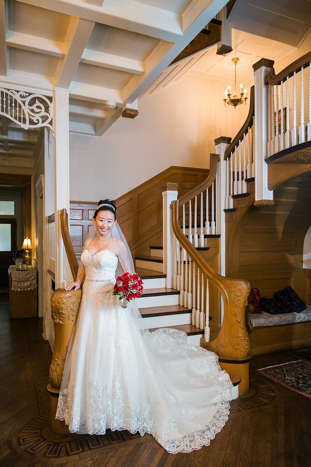 Sarah's bridal portrait at the bottom of the stairs