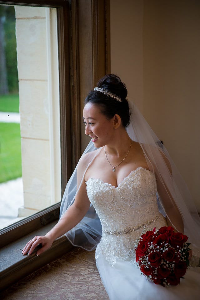 Sarah's bridal leaning on the window