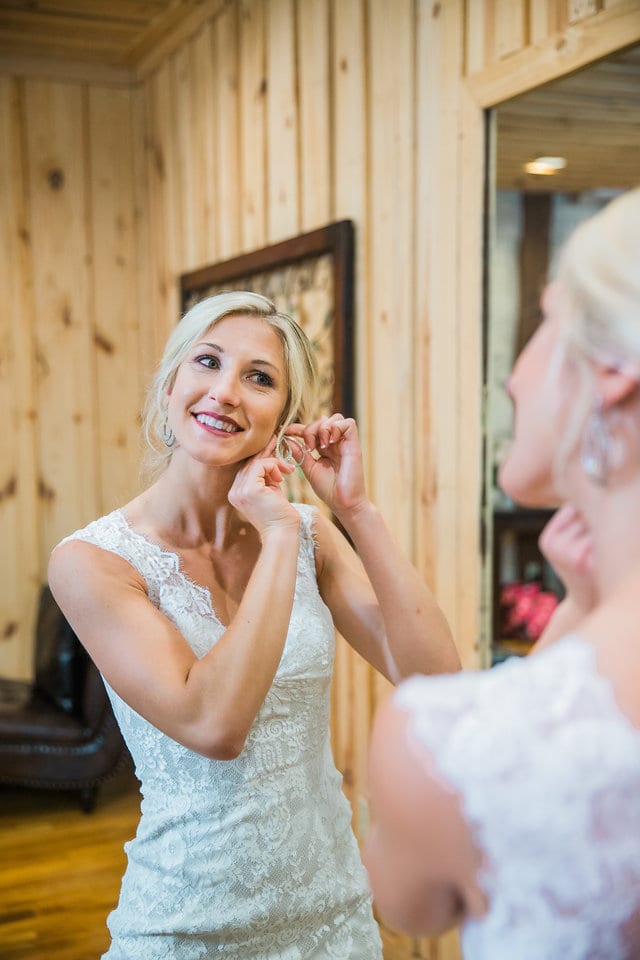 Anna putting on her earrings for the wedding