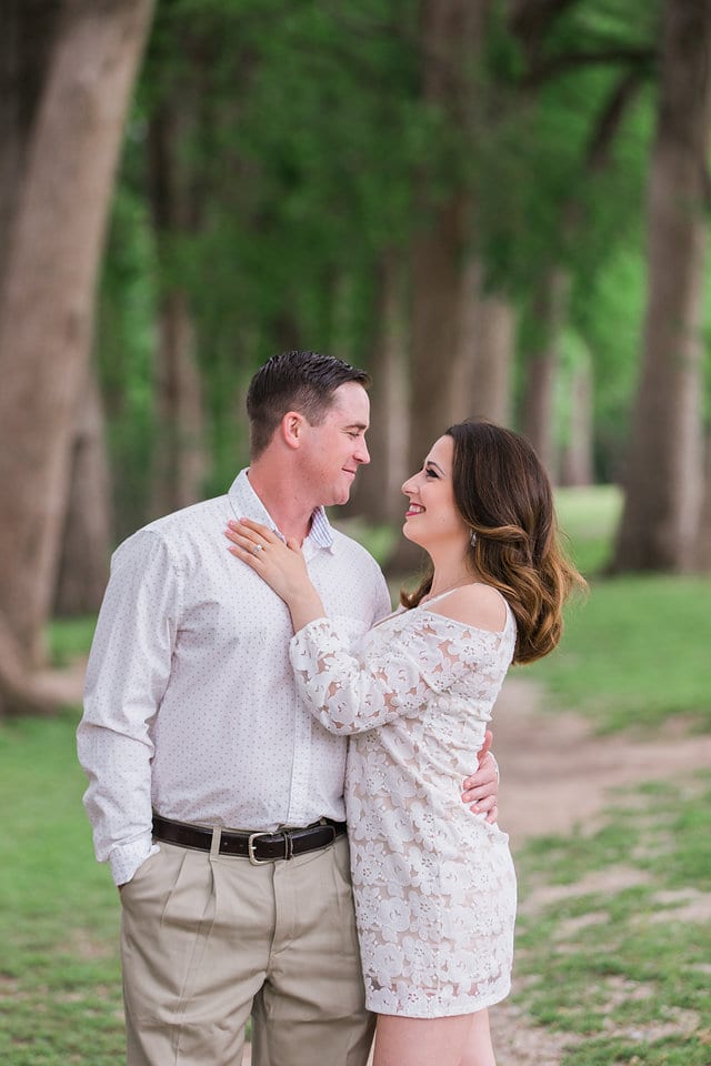 Grisham engagement portrait of couple holding at each other