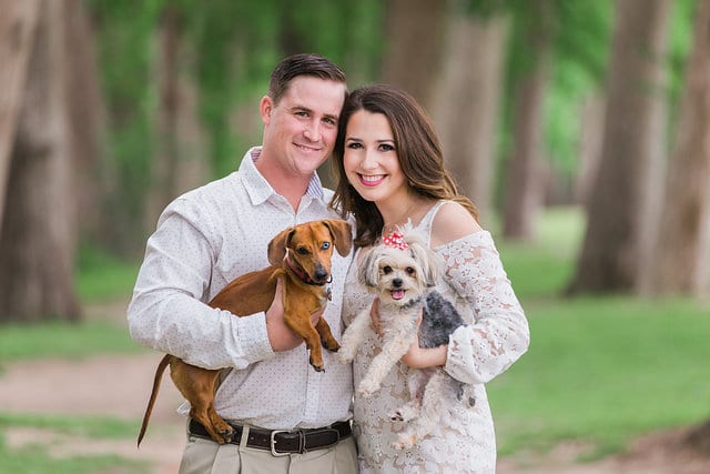 Grisham engagement portrait of the couple holding dogs