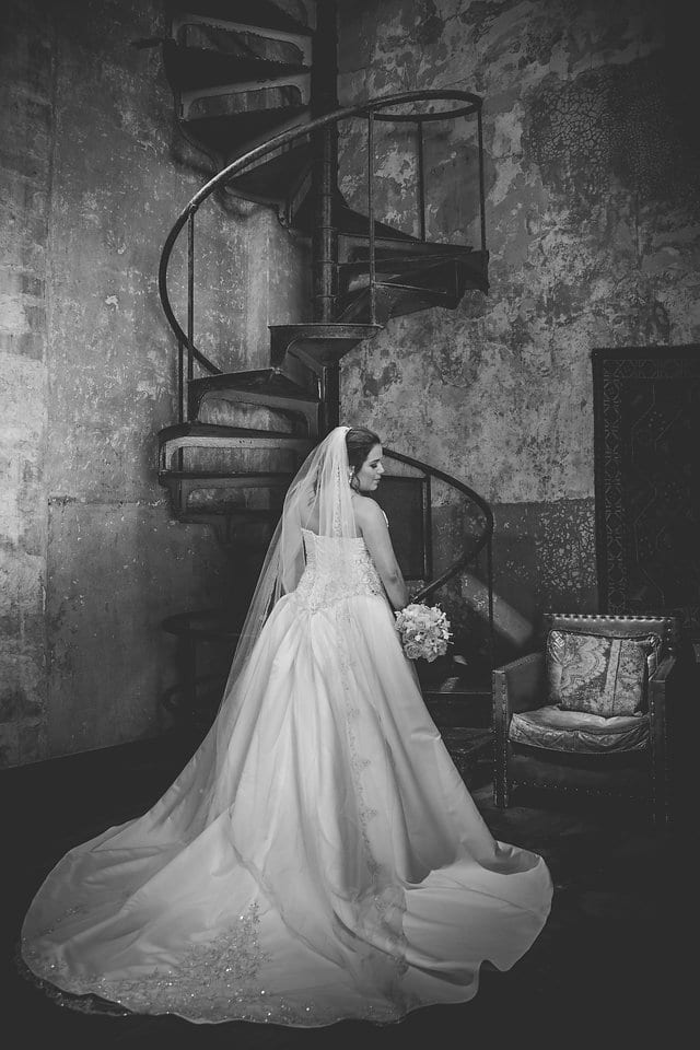 Annette bridal at Hotel Emma in the spiral staircase back of gown