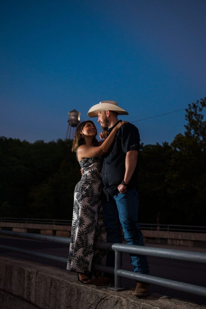 Kleiman engagement in Gruene sunset with tower