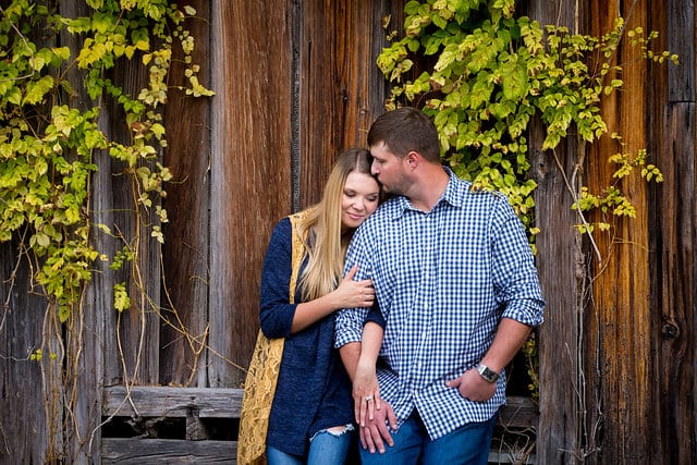 CT engagement session at Gruene in the wooden wall kissing