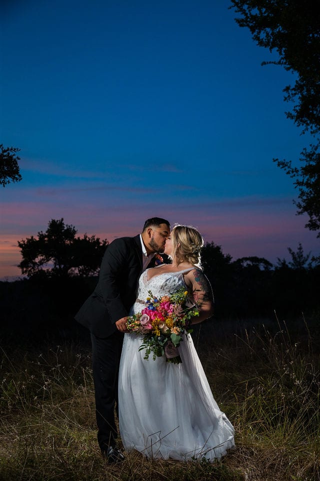 Katie C wedding the MIlestone sunset portrait kiss in the tall grass