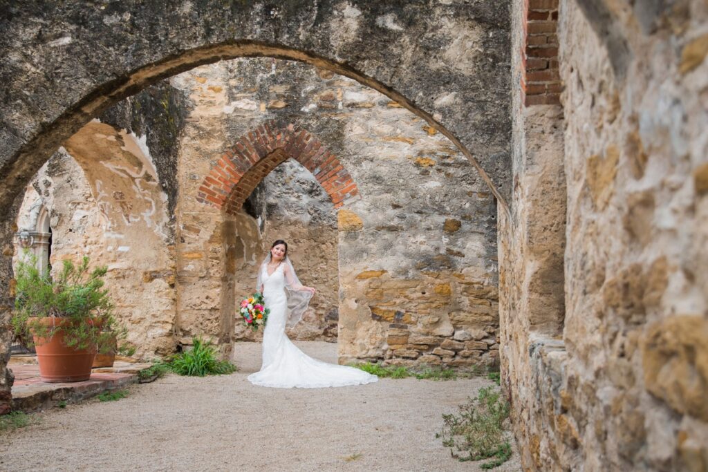 Gaby Bridal at Mission San Jose pointed door portrait with arch