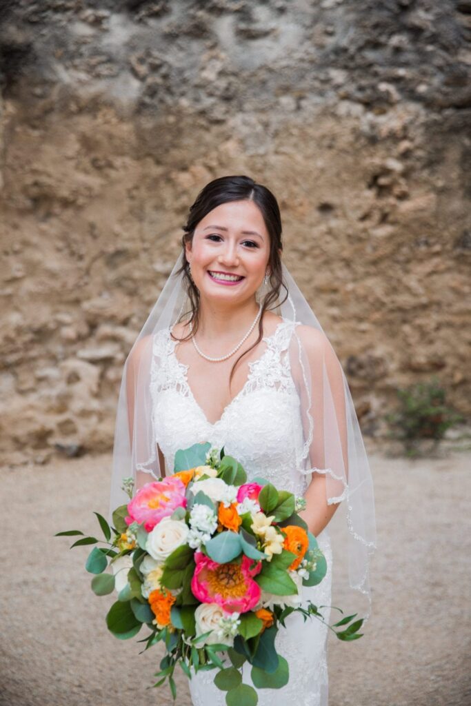 Gaby Bridal at Mission San Jose portrait with the bouquet