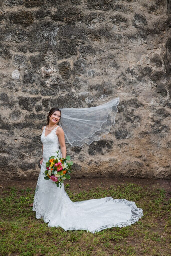 Gaby Bridal at Mission San Jose portrait with the veil blowing