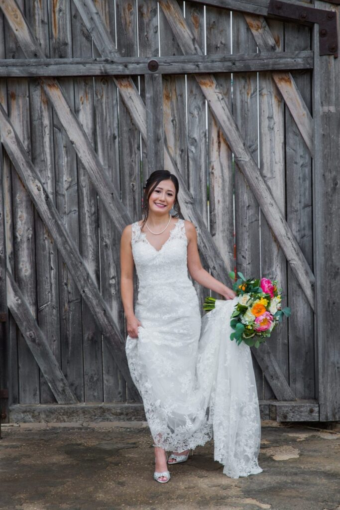 Gaby Bridal at Mission San Jose portrait with the wooden gate