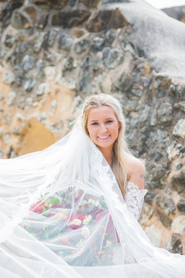 Kelsey's bridal at Mission San Jose stone wall portrait