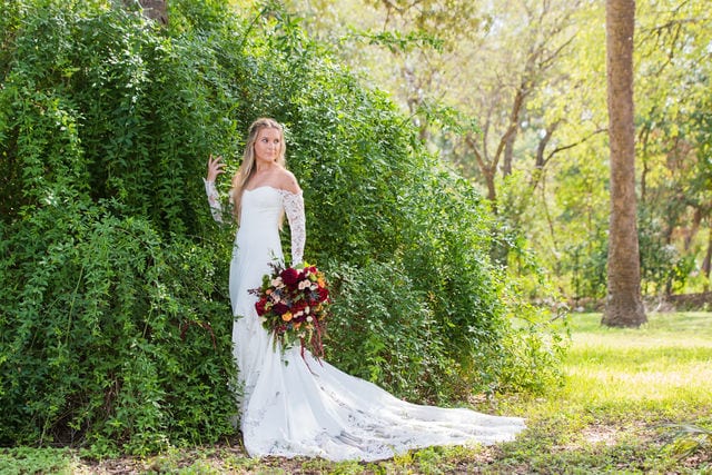 Kelsey's bridal at Mission San Jose at the greenery wall