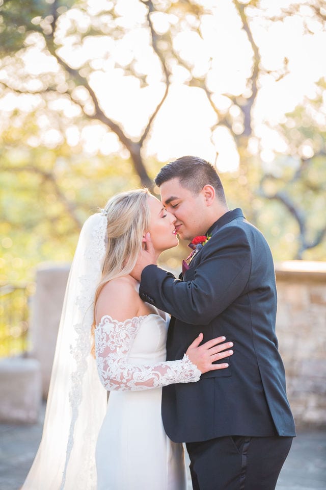Kelsey wedding Lost Mission couple sunlit kiss