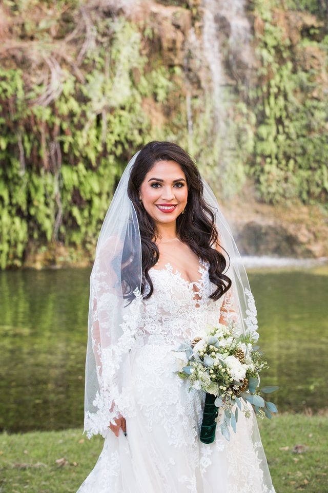 Bride at Canyon Springs by the waterfall wedding