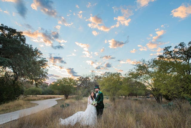 Bride and groom in the grass at Canyon Springs wedding