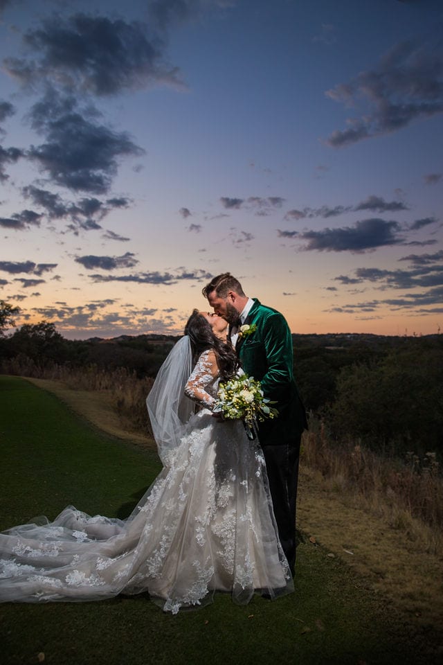 Bride and groom in the sunset kissing at Canyon Springs wedding