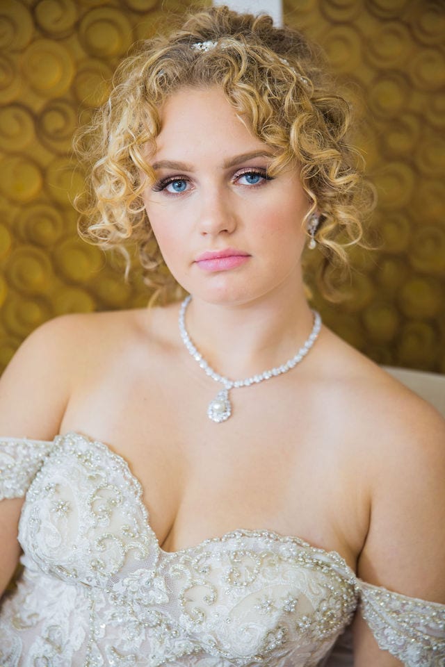 Bridal gown at I do the dress I Do with portrait with necklace