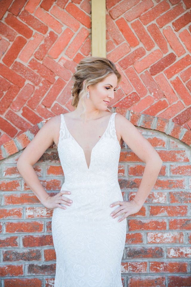 I do the dress I Do with bridal gown on brick wall