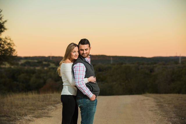 Engagement photography at JW Marriott top of the hill at sunset hug