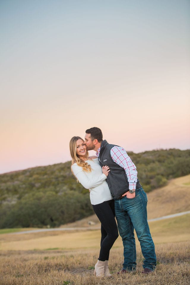 Engagement photography at JW Marriott top of the hill at sunset in the field
