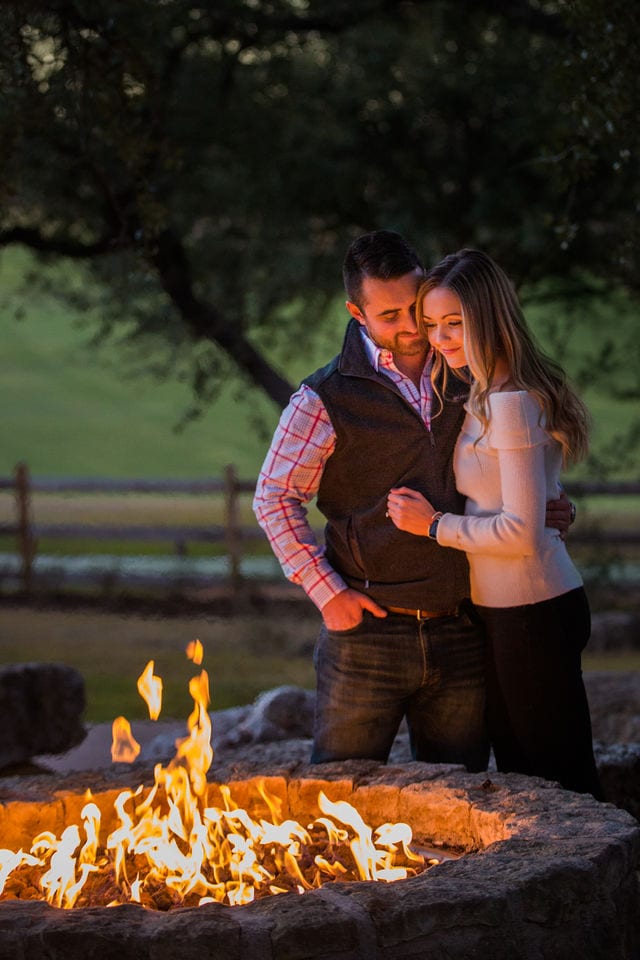 Engagement photography at JW Marriott couple cozy by the fire