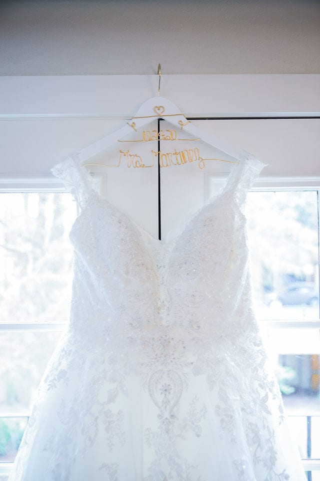 Wedding gown hanging up at Omni La Mansion