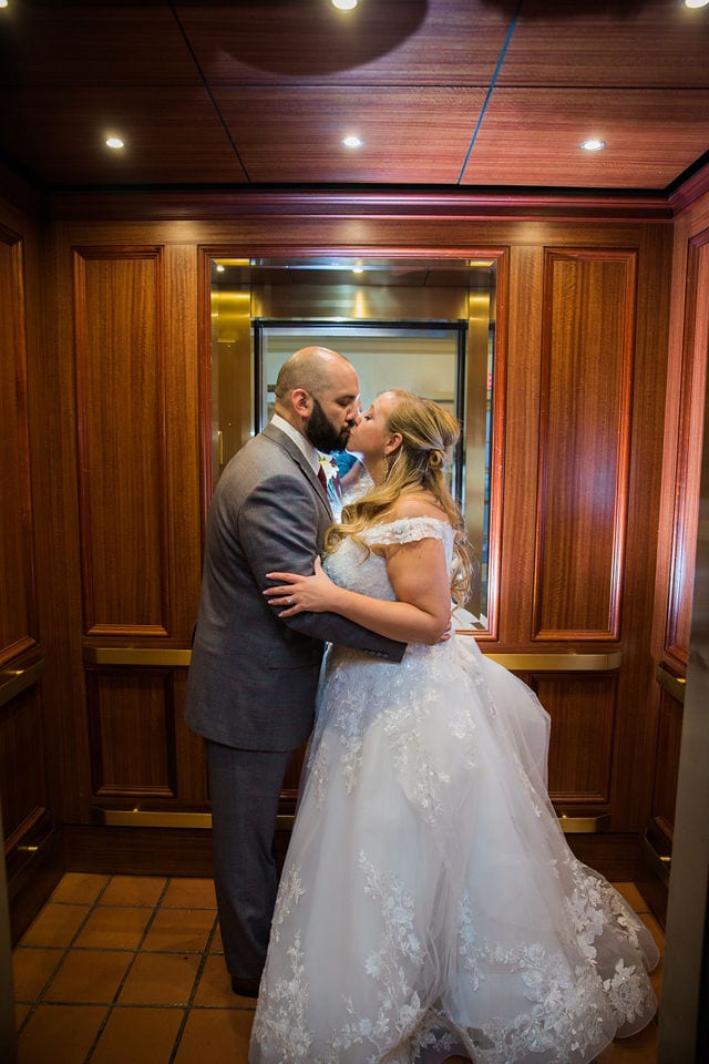 Bride and groom in an elevator at Omni La Mansion on the riverwalk, San Antonio