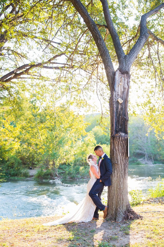 Couple under the tree by the river at Milltown New Braunfels Wedding