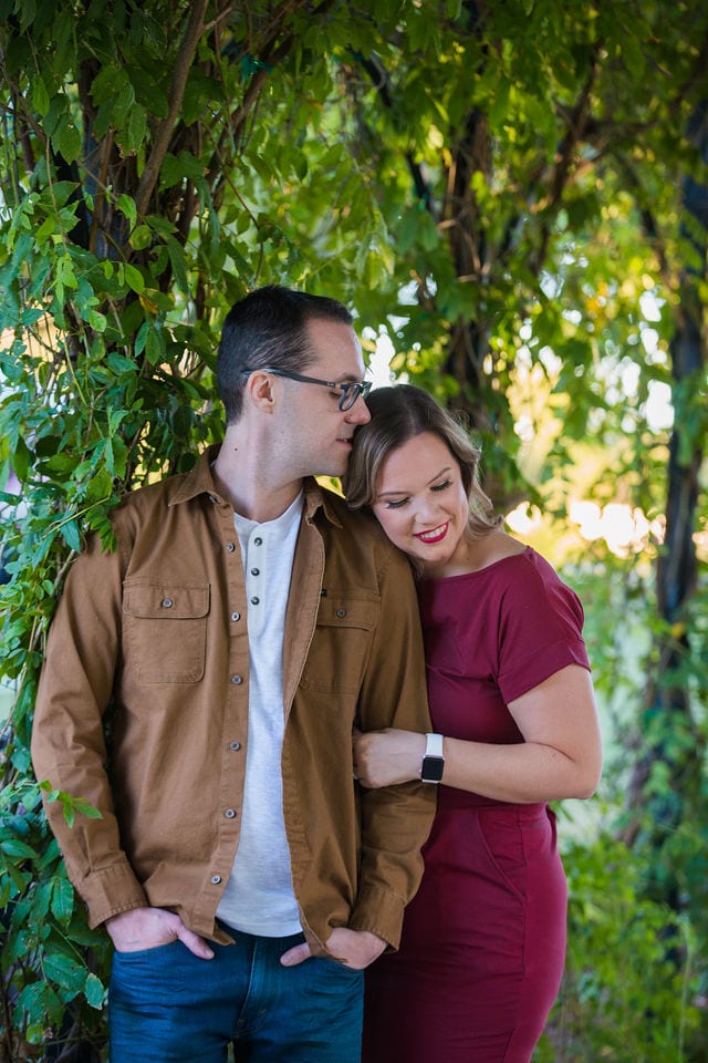 Weber couple at San Antonio Botanical Gardens in gazebo head kiss