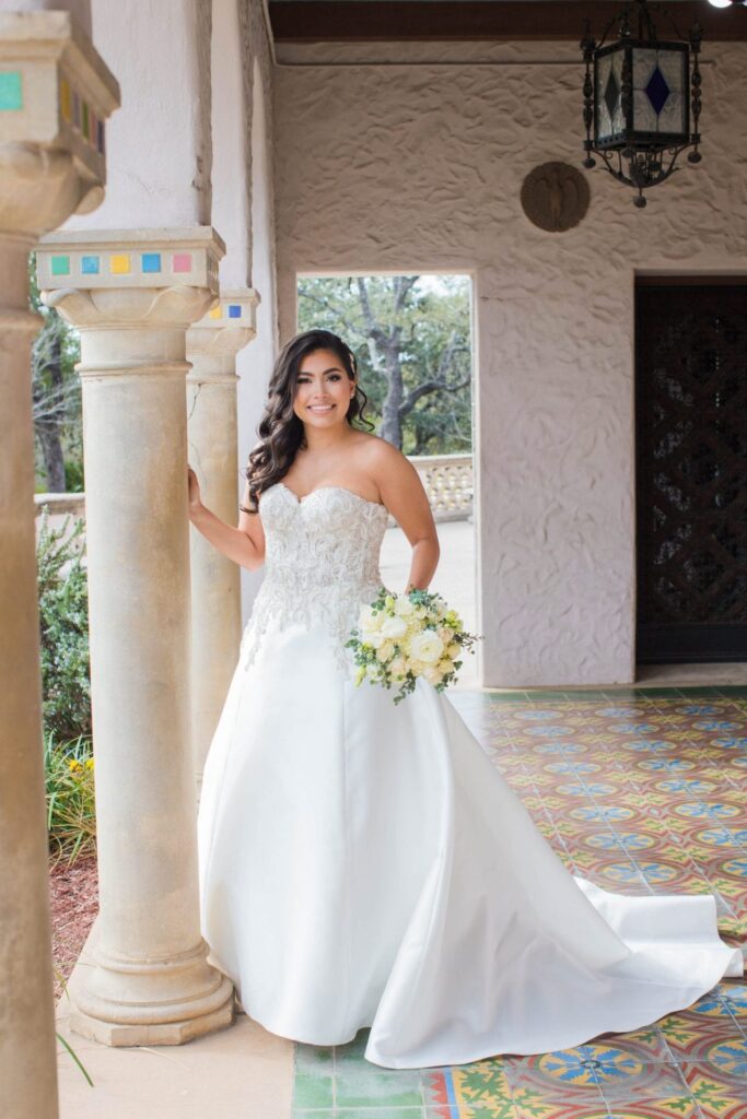 Bridal portrait in arches, Camille at McNay Art Museum