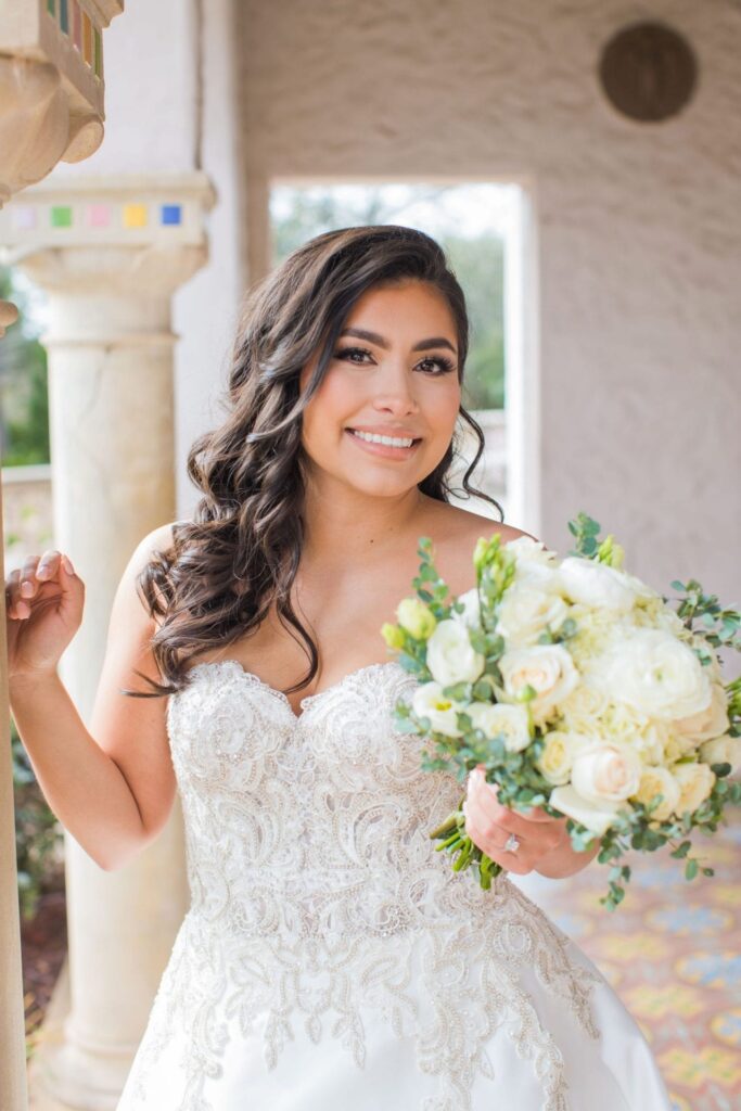 Cose up bridal portrait in arches, Camille at McNay Art Museum