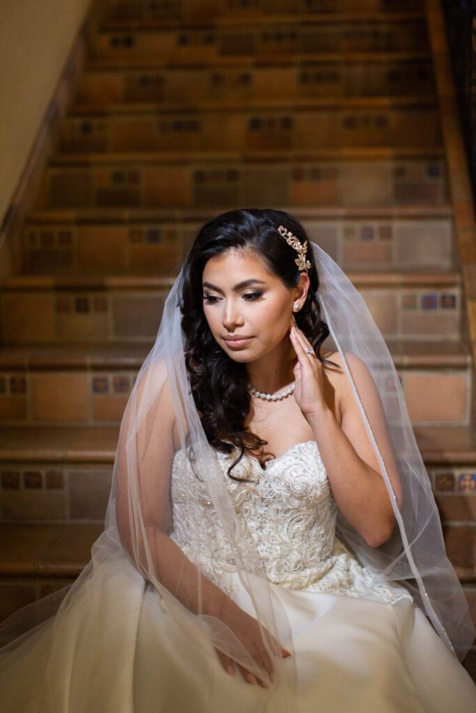 Bridal portrait sitting on the staircase, Camille at McNay Art Museum
