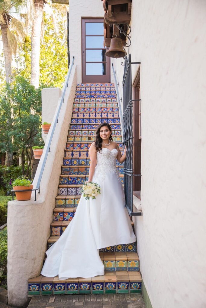 Bridal portrait on tile stairs, Camille at McNay Art Museum