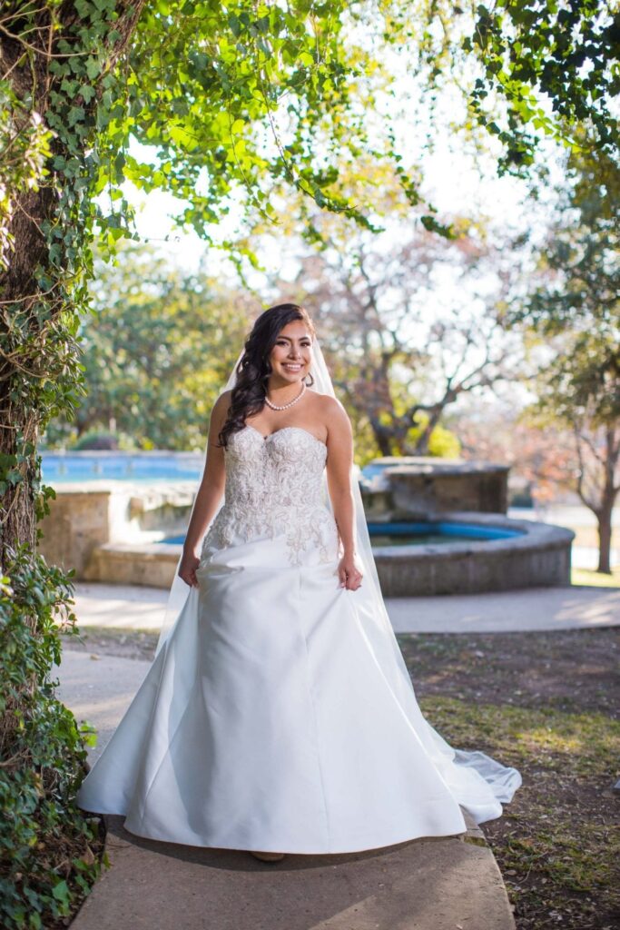 Bridal portrait side fountain walking, Camille at McNay Art Museum