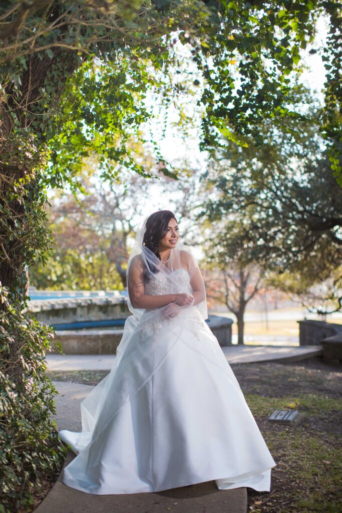 Bridal portrait side fountain hugging, Camille at McNay Art Museum