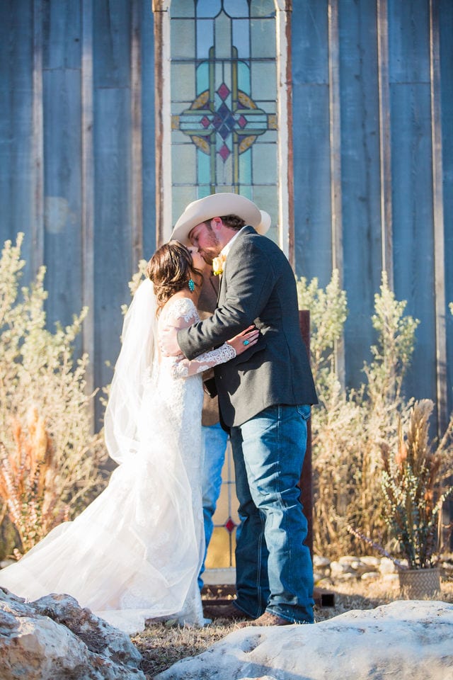 Baleigh's ceremony kiss Eagle Dancer Ranch Wedding