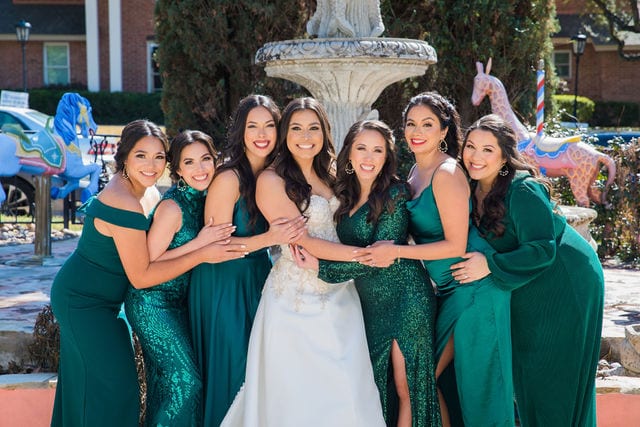 Camille's Bridesmaids hugging before the wedding at the McNay