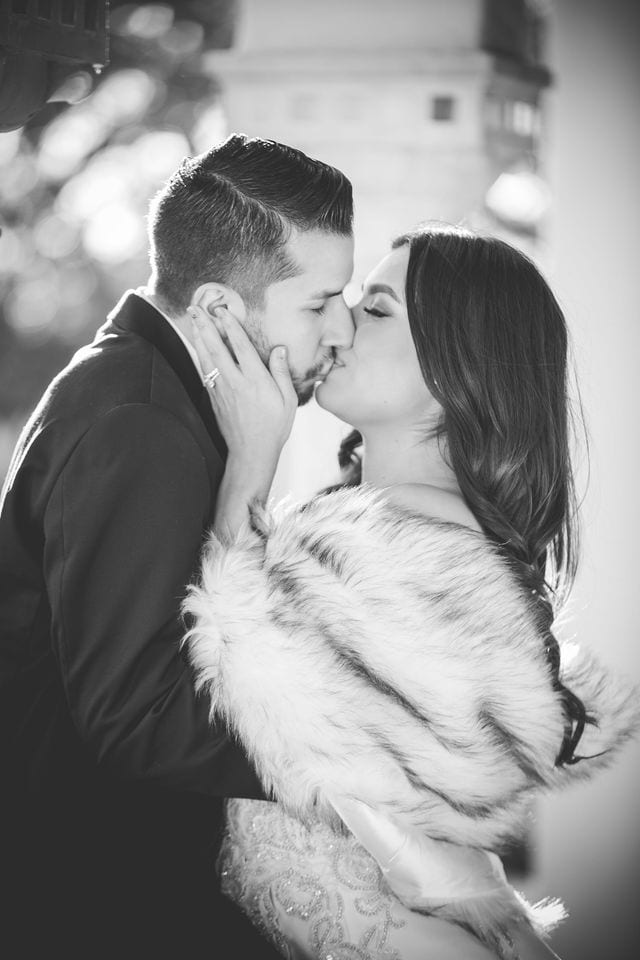 Camille and DJ black and white kiss portrait at the McNay