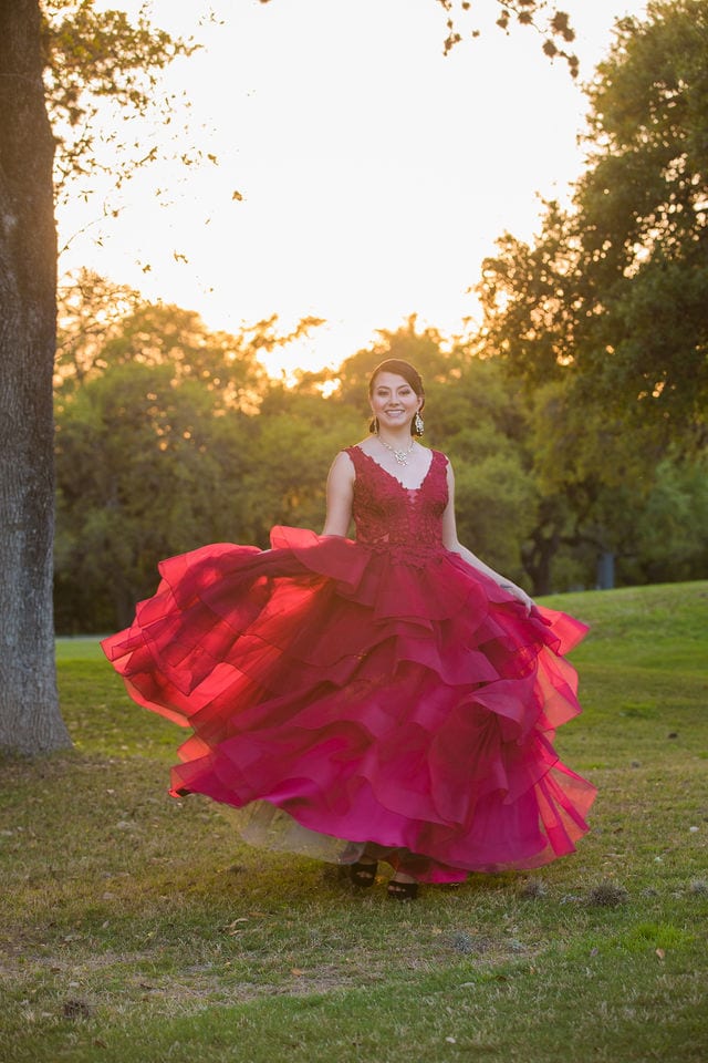 Dominion country club wedding model wearing red twirling