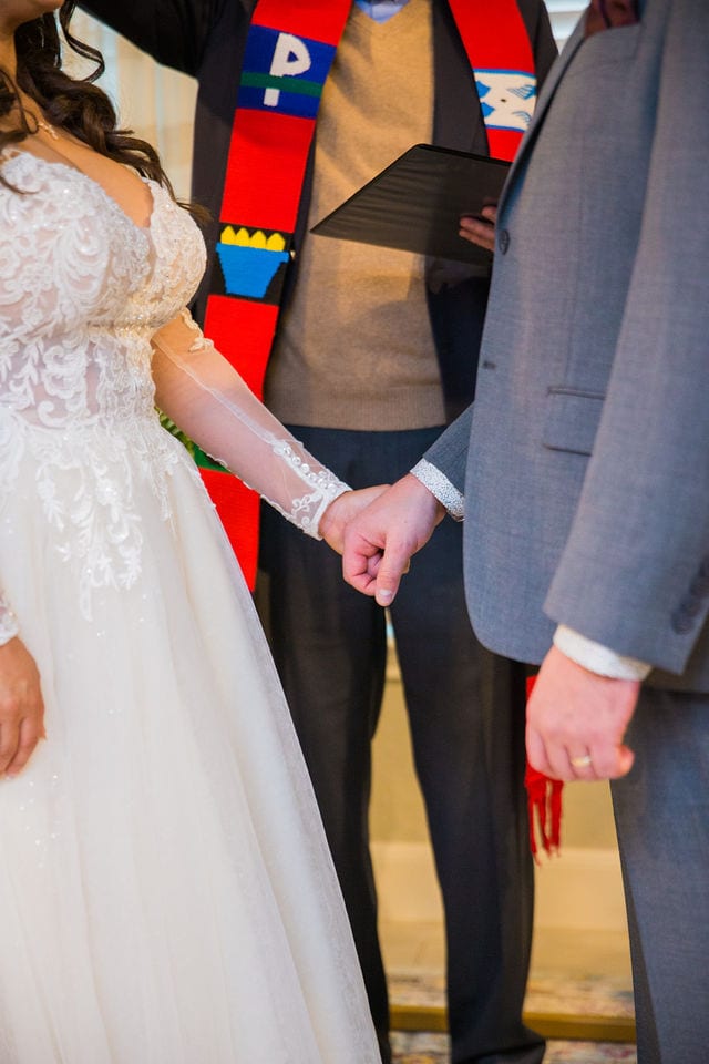 April's San Antonio wedding ceremony holding hands