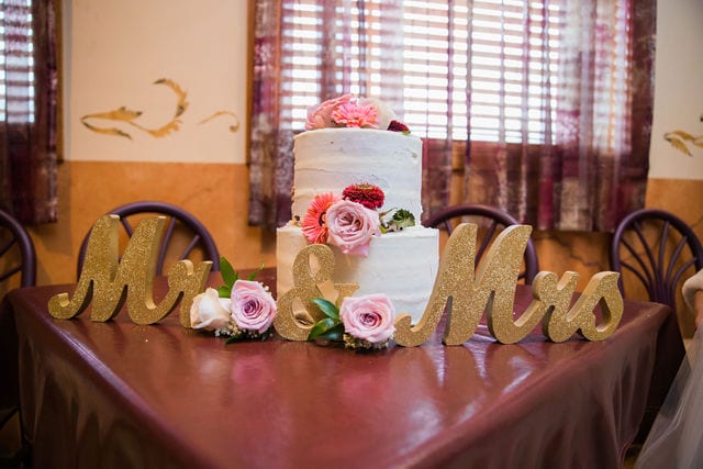 April's San Antonio at the wedding cake on table